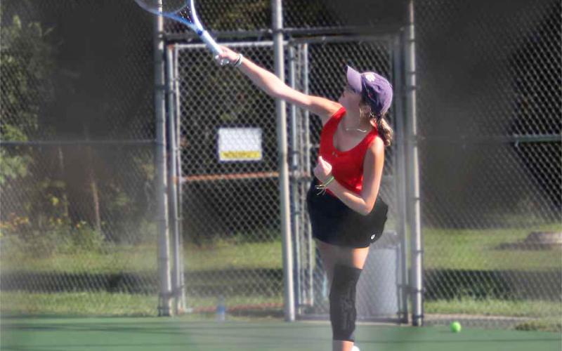 Press Photo/Will Woolever - Junior standout Alyssa Smith serves against Pisgah Sept. 27. Smith advanced to the second round of the 3A West Regional Singles Championship Oct. 22.