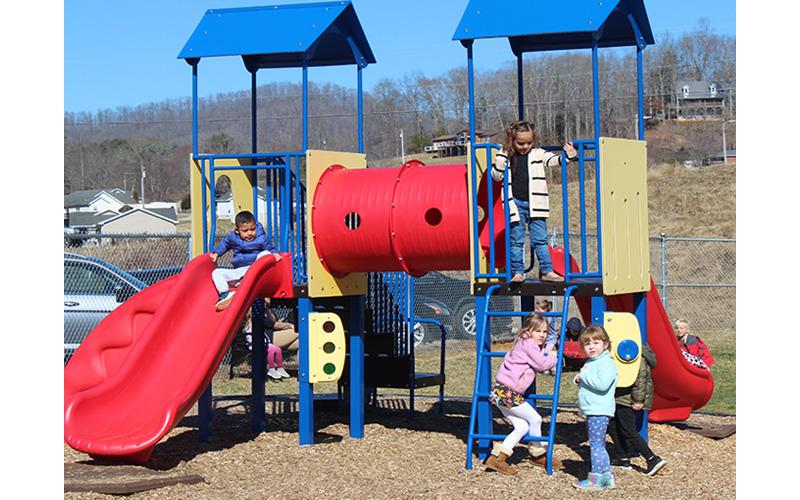 Press photo/Jake Browning Macon County Schools is currently accepting applications for the Pre-K program for the 2022-2023 school year. The Board of Commissioners and Macon County Schools are exploring ways to expand the program so more children can attend. Pictured are Pre-K students at South Macon Elementary School enjoying a sunny winter day on the playground for Pre-K students.