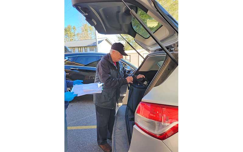 Photo submitted - Senior Center volunteer Victor Forbes prepares for his route delivering meals. In 2021, volunteers contributed more than 1,000 hours for the home-delivered meals program offered through the Crawford Senior Center in Franklin.