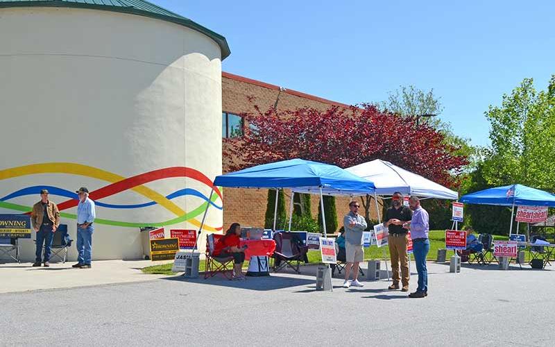 Press photo/Mia Overton - Candidates gather at the Macon County Community Building during early voting on Monday, May 9.