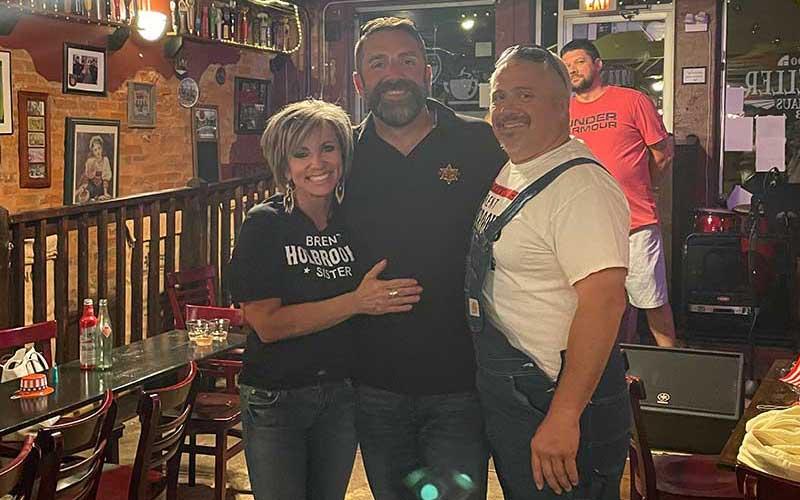 Press photo/Mia Overton - Brent Holbrooks (center) celebrated with family and friends at Rathskeller on May 17 as election results showed him the winner in the race for Macon County Sheriff. The recount on June 2 confirmed Holbrooks had the most votes in the race with four other Republican candidates. He is pictured with his sister April Chastain and brother Eric Duvall.