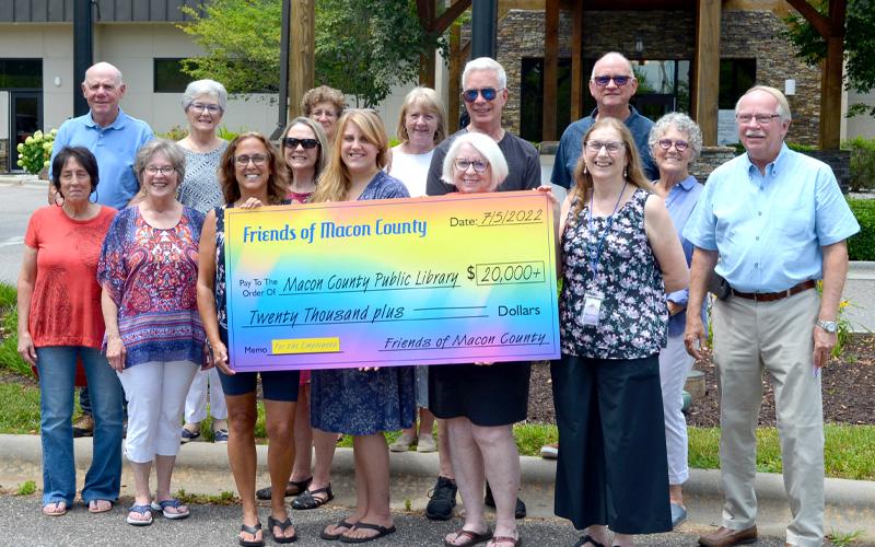 Press photo/Mia Overton Library supporters raised $30,455 to support salary increases for library employees. The effort came about after a request for a $20,000 increase in funding for the library was not approved by the Board of County Commissioners. Lenny Jordan said the original goal was to raise $20,000, but they exceeded that with 280 people making contributions over a 10-day period.