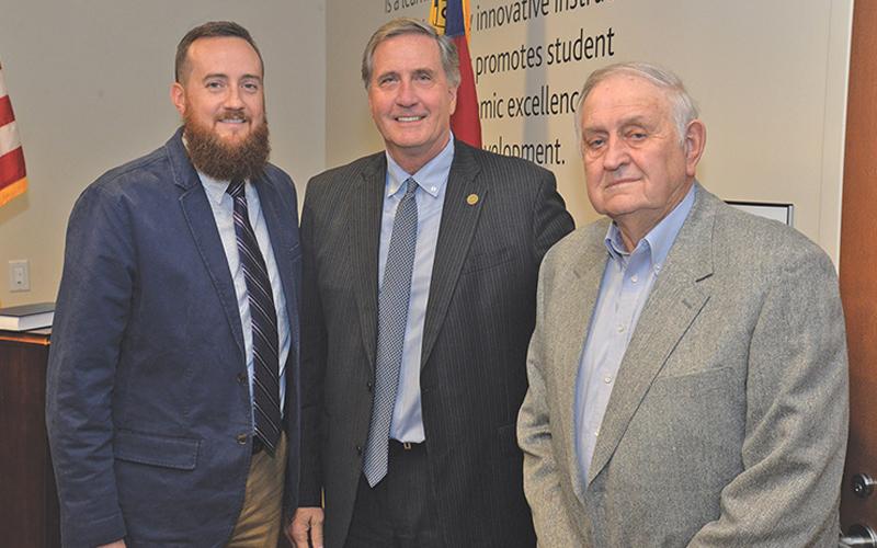 Photo submitted Jerry Sutton (right) served on the SCC Board of Trustees from 1983 to 2015. He participated in the swearing-in ceremony for his grandson Cory McCall (left) in 2019. They are pictured with SCC President Don Tomas.