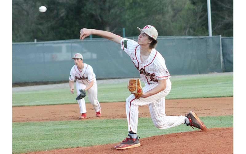 Press photo/Will Woolever - Junior pitcher Josiah Hursey is pictured in the first inning of his four-hit, five-strikeout complete game versus East Henderson March 24.