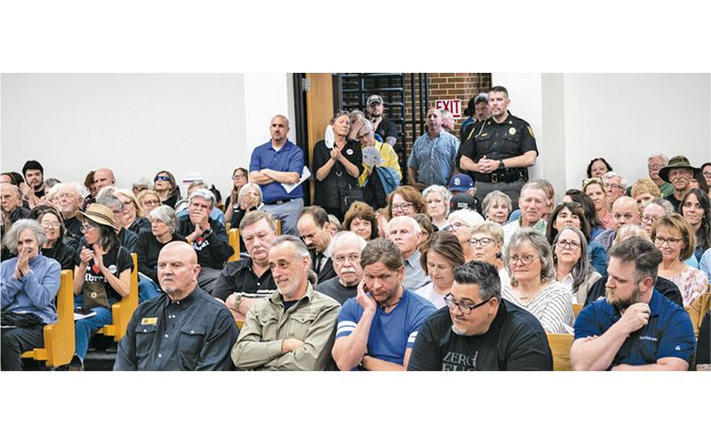 Photo/Bob Scott It was a standing-room only crowd at the April 11 Board of Commissioners meeting. Most attendees were there to speak about the library. Due to the size of the crowd the meeting had to be moved from the commissioners’ board room to the courtroom on the fourth floor of the courthouse.