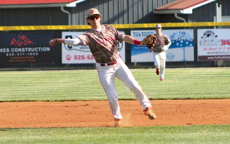 Press photo/Will Woolever - Junior shortstop Ian Knepp throws to first versus A.C. Reynolds April 19 at McConnell Field.