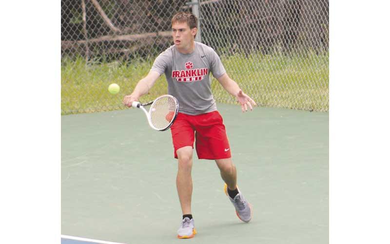 Press photo/Will Woolever - Sophomore Gavin Rinker backhands a ball in the Mountain Seven Conference Tournament April 25.