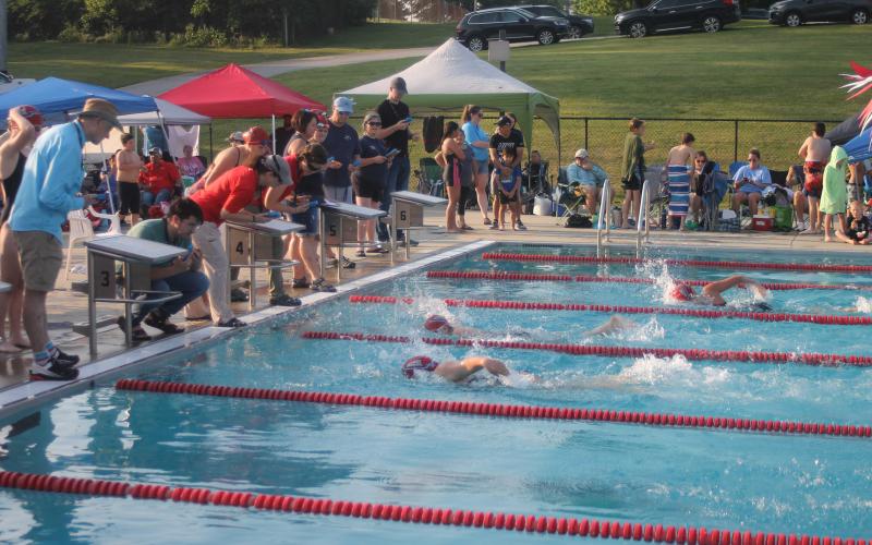 Press photo/Will Woolever - Franklin Amateur Swim Team timers watch a photo finish between Kenna Keyworth (foreground) and Breanna Pendergrass in the girls 13-14 50-yard freestyle. The team kicked off their summer season versus the Jackson County Swim Team at the Macon County Rec Park June 8.