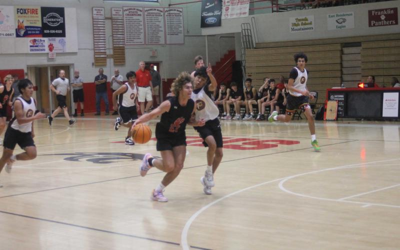 Freshman Will Rauers drives to the basket in a scrimmage vs. Cherokee June 5 on Tom Raby Court (Press photo/Will Woolever).