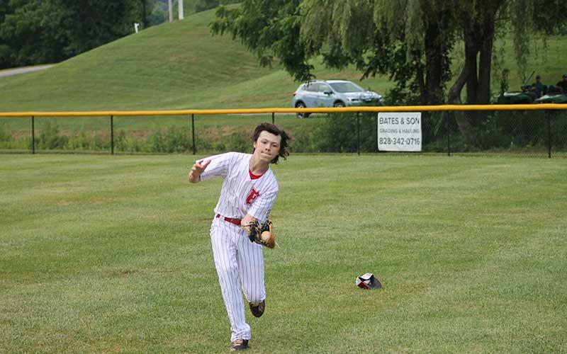 Press photo/Will Woolever - Right fielder Max Cable leaves his hat behind to make a difficult basket catch in the first round of the 12U Little League State Tournament July 15 at Parker Meadows. After losing their first game to Myers Park, the Franklin 12U Majors faced the Greenville Tar Heels in an elimination game July 17.