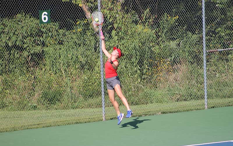 Senior Lydia Holland handles a tough bounce against Tuscola Aug. 23. (Press photo/Will Woolever)