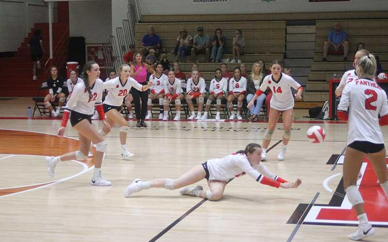 Press photo/Will Woolever - Junior setter/right side hitter Emma Ledford makes a diving save against East Henderson Aug. 24.