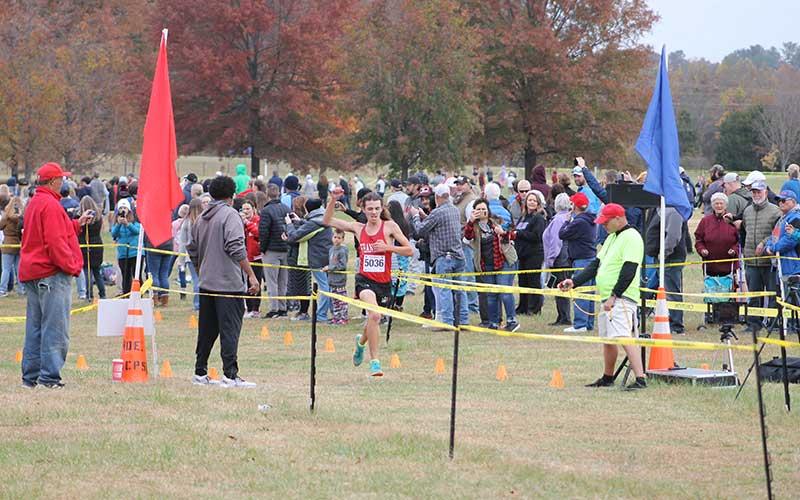 Press file photo - Senior Logan Russo crosses the finish line at last year’s 3A West Regional in Morganton.