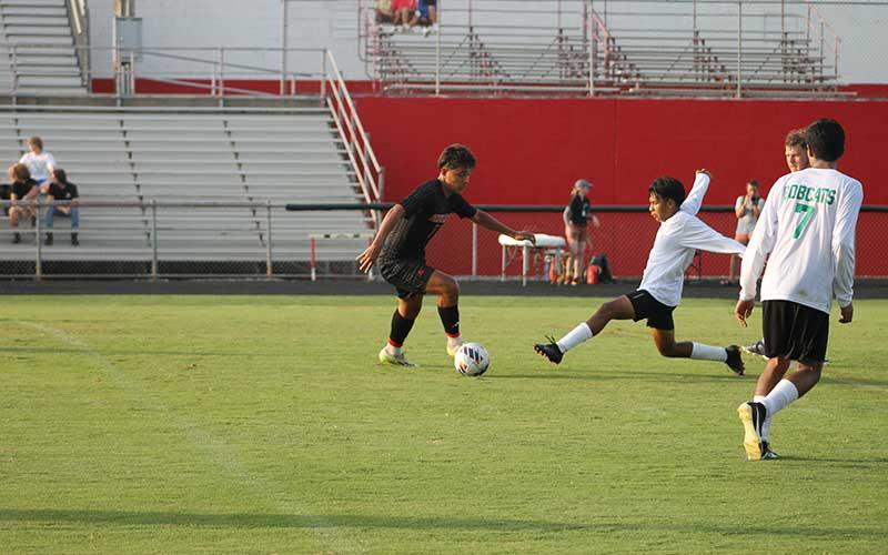 Press photo/Will Woolever - Senior Ulises Padron-Perez (left) puts a BREC defender on skates Aug. 21.