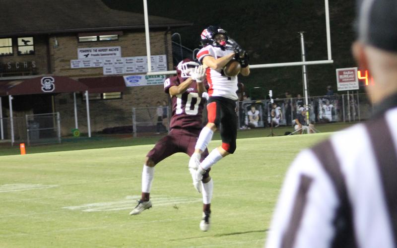 Press photo/Will Woolever.  Junior defensive back Braylon Dezarn intercepts a Swain deep pass near midfield in the second quarter.