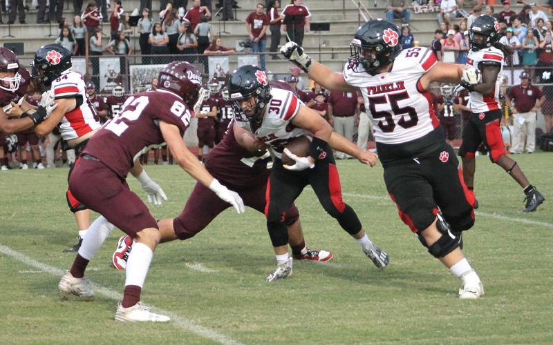 Press photo/Will Woolever.  Sophomore running back Addix Sutton fights through a tackle in Swain County Memorial Stadium Sept. 1.