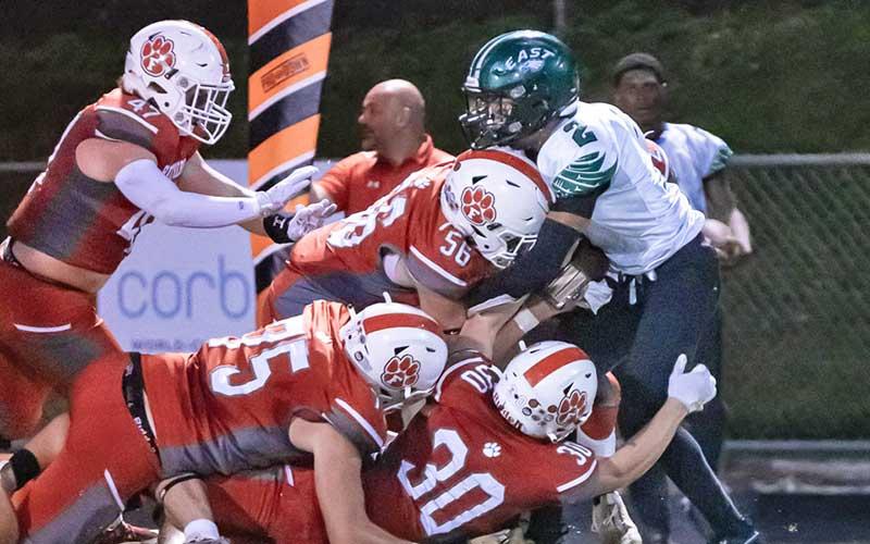 Photo courtesy of Tom Pantaleo - A gang of Panthers brings down an Eagle ball carrier at the Panther Pit Sept. 16.