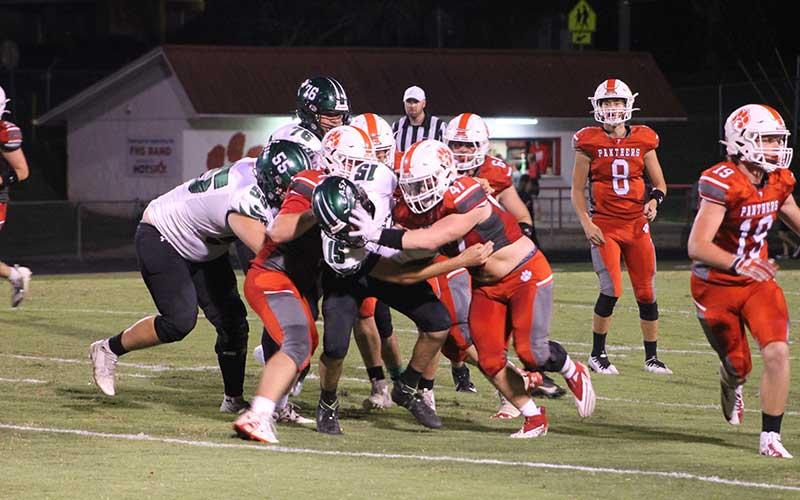 Press photo/Will Woolever - Senior Gabe Nickerson (right) stiff-arms a defender in Franklin’s 24-8 victory over East Henderson Sept. 15.