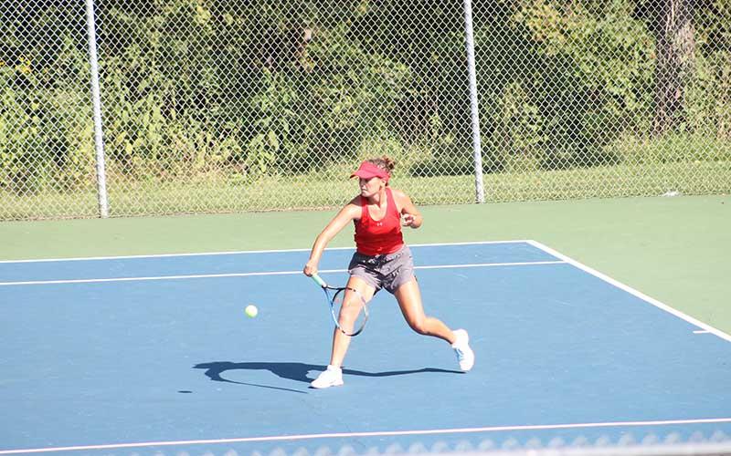 Press photo/Will Woolever - Junior Kate Phillips attempts a groundstroke in a recent match.