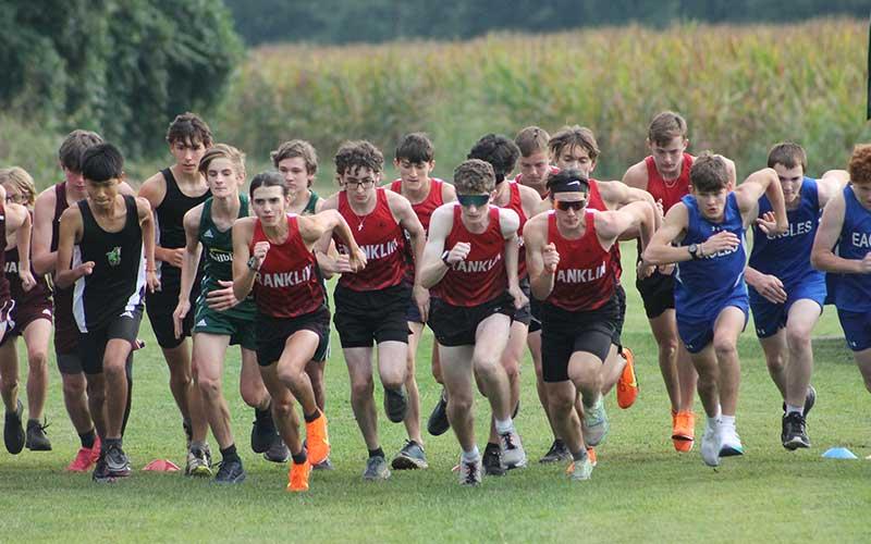 Press photo/Will Woolever - Franklin’s male distance runnners leave the starting line at Kituwah Sept. 16.