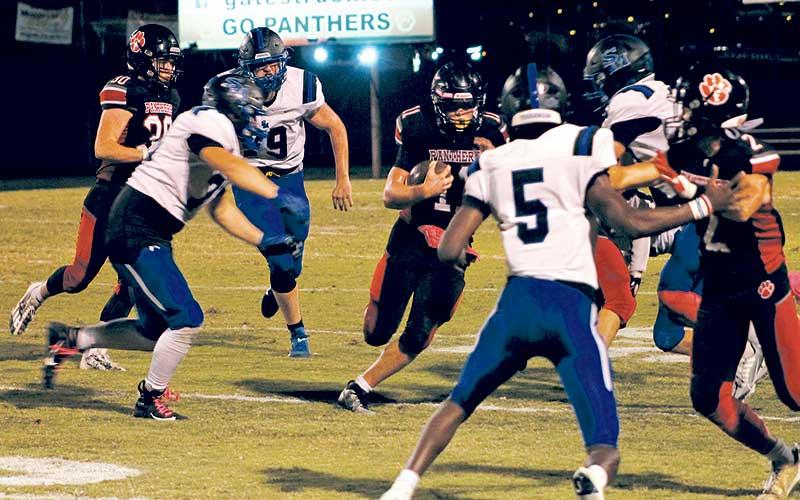 Press photo/Will Woolever - Junior tailback Braydon Hervey follows his blockers versus Smoky Mountain at the Panther Pit Oct. 13. The game may have been the last for the team in the stadium as county leaders discuss renovations to Franklin High School.