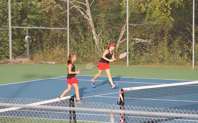 Press photo/Will Woolever - Sisters Laura and Lydia Holland are pictured in a doubles match versus West Henderson on Senior Night Oct. 4.