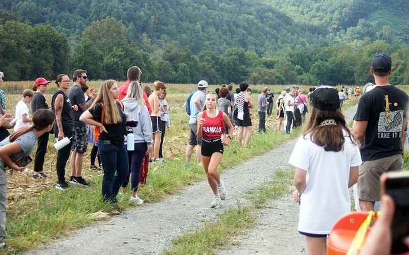Promising freshman Morgan Cress nears the finish line in a meet at the Cherokee Mother Town near Ela last month. As the first female Panther finisher, Cress placed fifth out of 71 runners at the Mountain Seven Conference Championship meet in Hendersonville  Oct. 17, earning All-Conference honors in the process. (Press file photo)
