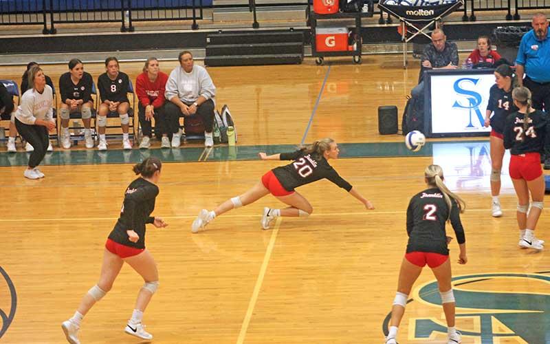 Press photo/Will Woolever - Junior Kyrah Bowles makes a tough diving save in the Mountain Seven Conference final versus North Henderson Oct.
