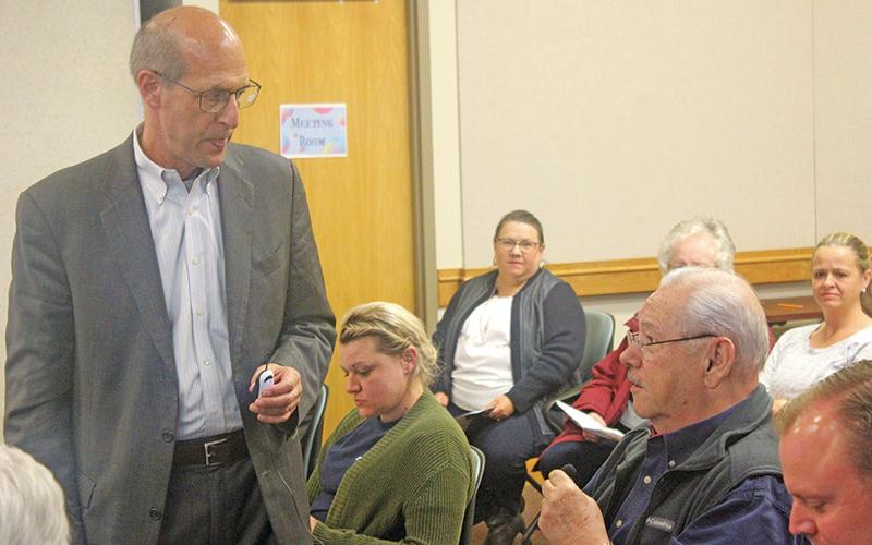 Press photo/Thomas Sherrill Franklin Mayor Jack Horton, seated right, speaks to Ronald Winters of Gibbins Advisors during a Nov. 1 community meeting.