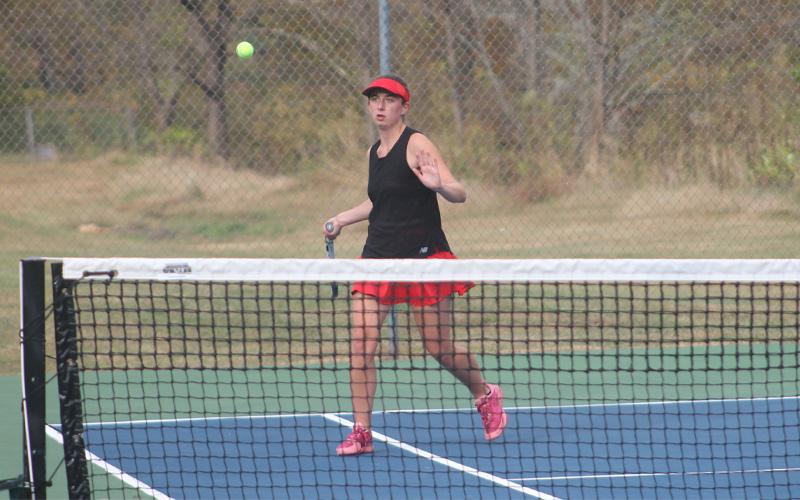 Senior Logan Guynn forehands a ball in Franklin’s second-round playoff matchup versus West Henderson Oct. 23 (Press photo/Will Woolever)