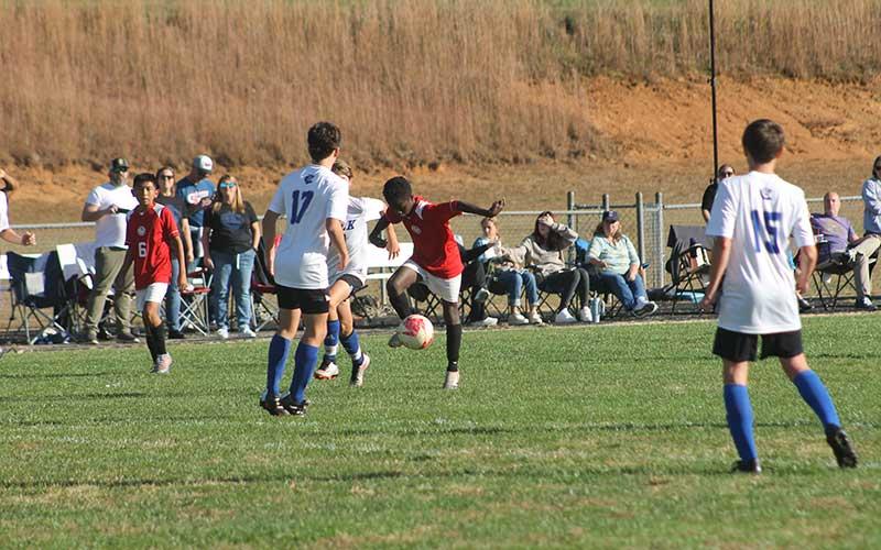 Press photo/Will Woolever - Sam Antoine showcases some fancy footwork in the Blue Ridge Athletic Conference  match Oct. 23.