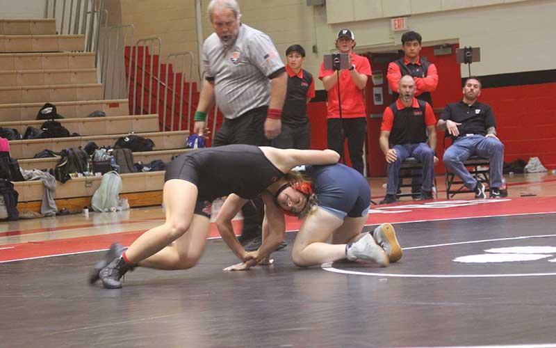 Junior Malaina Alberry locks horns with a wrestler from Enka in Franklin’s first home meet Nov. 16.  (Press photo/Will Woolever)