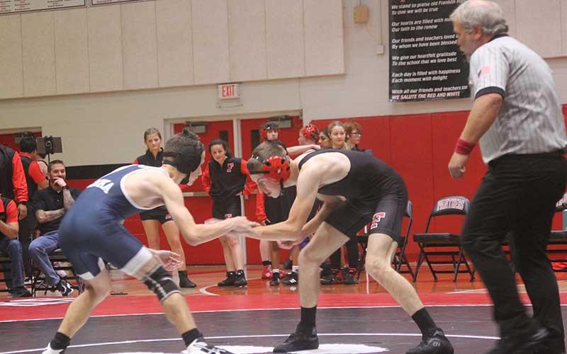 Press photo/Will Woolever - Senior Wyatt Browning batlles a wrestler from Enka in Franklin’s first meet of the season Nov. 16 on Tom Raby Court.