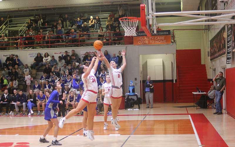 Press photo/Will Woolever - Senior Avery Moffitt (left) and junior Aubrey Haley fight for a rebound against Smoky Mountain Jan. 12.