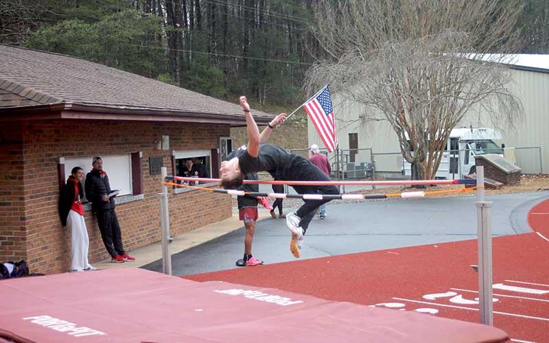 Press photo/Will Woolever - Junior Adam Rogers competes in the high jump at Swain Jan. 24.