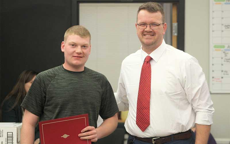Press photo/Thomas Sherrill - Franklin High School senior Josh Mason with FHS Interim Vice Principal Dan Gibson during the Feb. 19 meeting of the Macon County Board of Education.