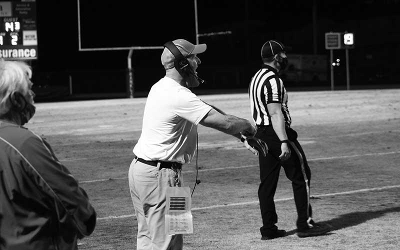 Press file photo - Brooks shouts instructions to his players against Hendersonville March 12, 2021.