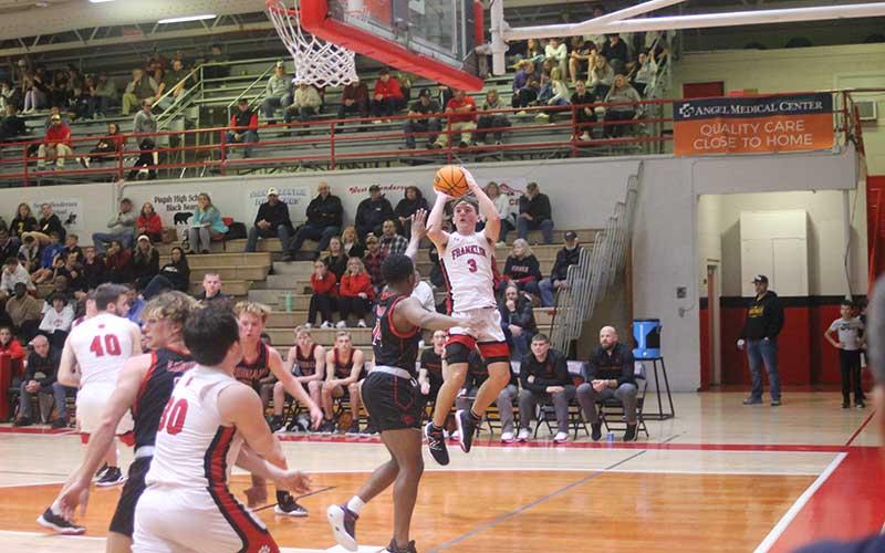 Press photo/Will Woolever - Junior Max McClure attempts a shot versus Pisgah Feb. 16. The guard recorded his 1,000th point for Franklin in the second quarter.