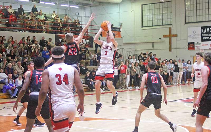 In this Press file photo, junior Max McClure attempts a free-throw line jumper versus Pisgah Jan. 30. At Smoky Mountain Feb. 6, the forward scored 47 points, breaking  Franklin’s all-time single-game points record.