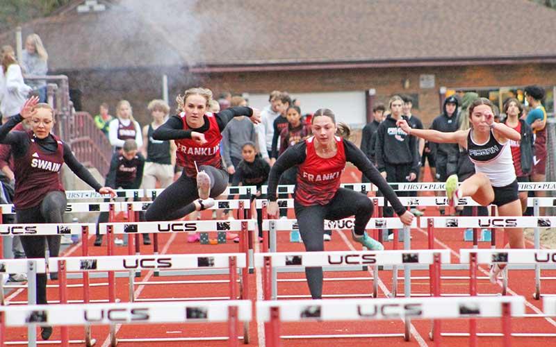 Press file photo - Senior Talley Kinsland (left) and junior Addison Coker compete in the 55-meter hurdles at Swain Jan. 24.