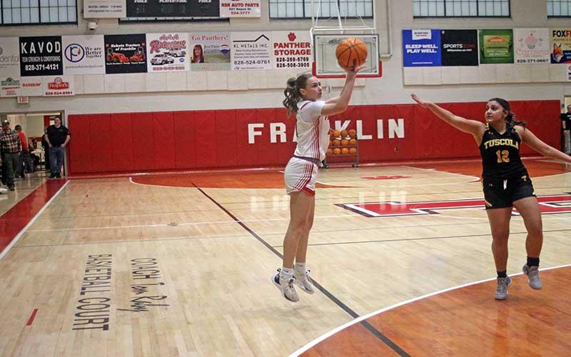 Press photo/Will Woolever - Junior guard Aubrey Haley attempts a 3-point shot versus Tuscola Feb. 16.