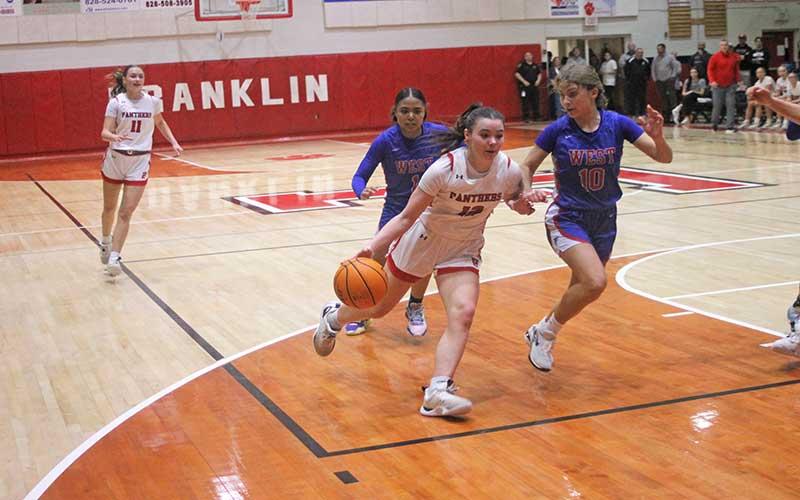 Press file photo - Junior guard Cali Queen brings the ball upcourt in Franklin’s Senior Night win over West Henderson Feb. 9