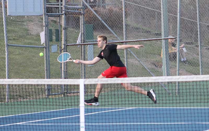 Press photo/Will Woolever - Junior Gavin Rinker tries to chase down a ball in Franklin’s #1 singles match versus Tuscola March 4.