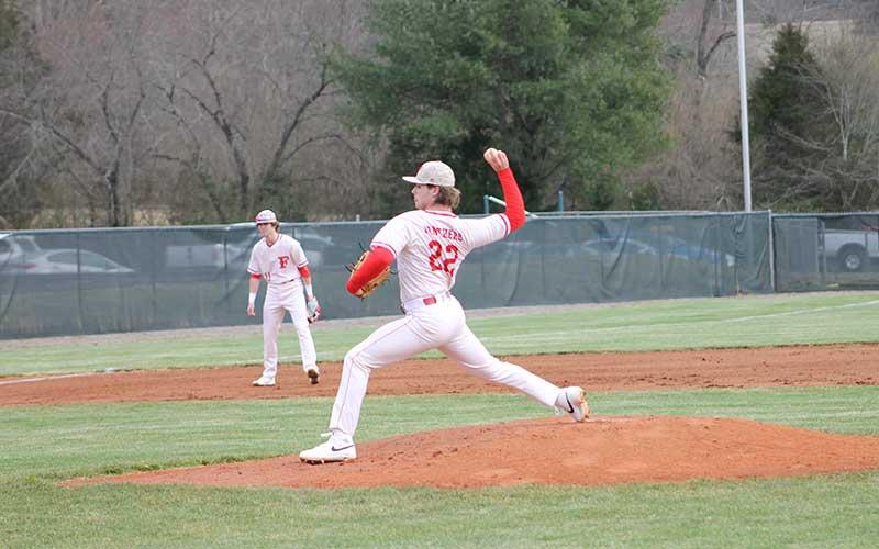 Press photo/Will Woolever - Senior Abram Apel pitches to Murphy in Franklin’s season-opening win Feb. 29.