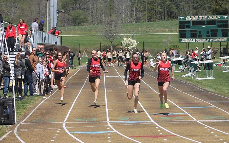Press photo/Will Woolever - Four of Franklin’s deep stable of freshmen girls compete in the 100-meter dash at Rabun Gap April 13. Pictured are Bailey Callahan, Kamden Reis, Audrey Pressley and Anna Timan.