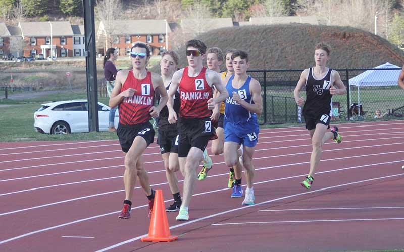 Press photo/Will Woolever - Seniors Logan Russo (left) and Barrett Stork lead the pack in the 1,600-meter run at Western Carolina University March 7.