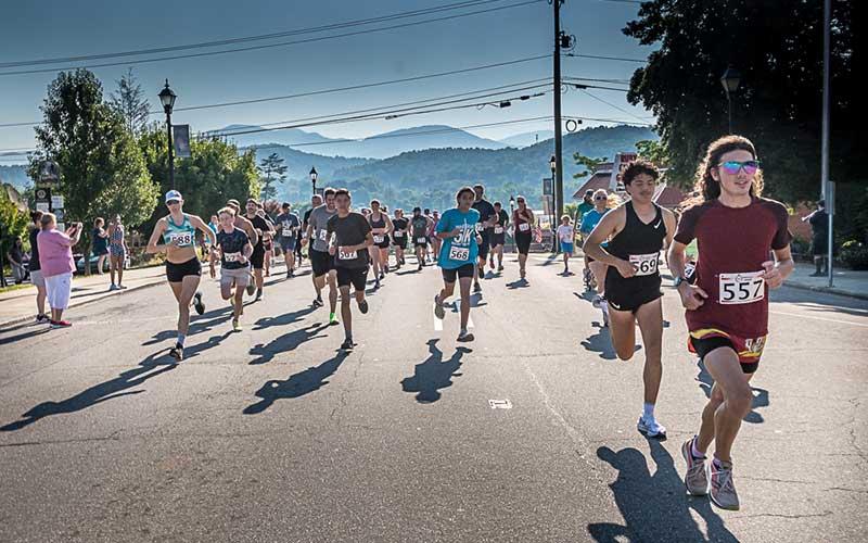 Press photo/Will Woolever - Participants stream down Main Street June 15 during Franklin’s annual Braveheart 5K benefitting the Scottish Tartans Museum. Logan Russo (far right, bib #557) of Franklin was the overall winner.
