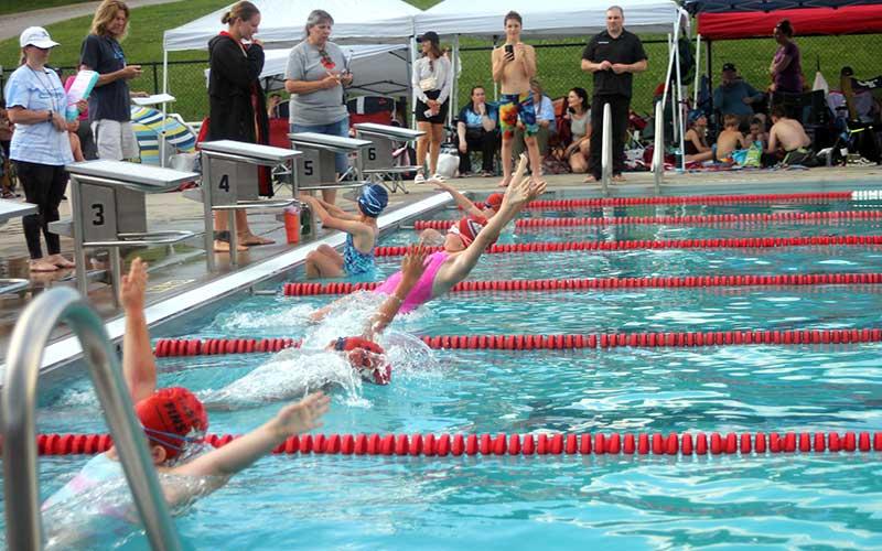 Press photo/Will Woolever - (From foreground) Brisa Cruz, Bailey Dockery, Agatha Jestin and Adelaide Capaforte leave their starting blocks in the girls 8 &amp; under 25-yard backstroke at the Macon County Rec Park June 6.