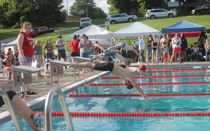 Press photo/Will Woolever - (From foreground) Brantley Dezarn, Tatham Peters, Jayce Powell and Micah Fowler dive off the block for the boys 8 &amp; under 25-yard freestyle June 6.
