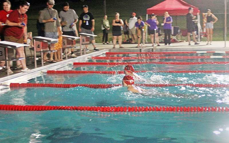 Press photo/Will Woolever - Larken Lynch (front) and Leila Pinkston race to a photo finish in the girls 9-10 50-yard butterfly at the Franklin Amateur Swim Team’s home meet with Waynesville June 20.